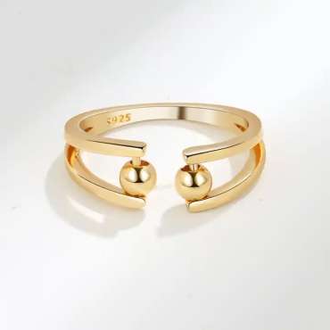 Anxiety ring med åben front i guldfarve – justerbar ring med bevægelige kugler til ro og fokus

