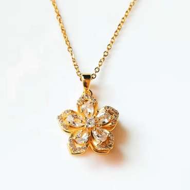 Fidget halskæde zirkonblomst guldfarvet – smykke med blomsterformet vedhæng

