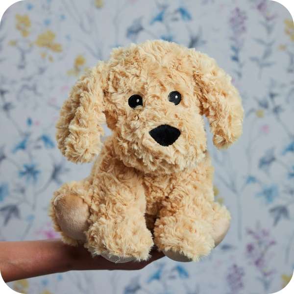 Warmies cockerpoo på baggrund – sanselig bamse til hygge og ro


