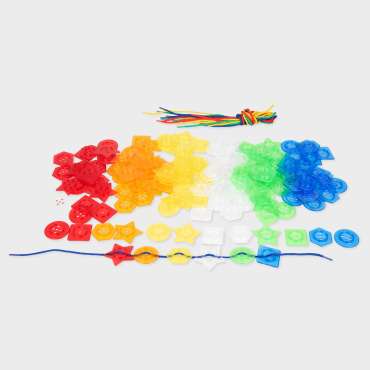 Transparente stabelbare knapper i regnbuefarver – sanselegetøj til sortering, farver og lysleg

