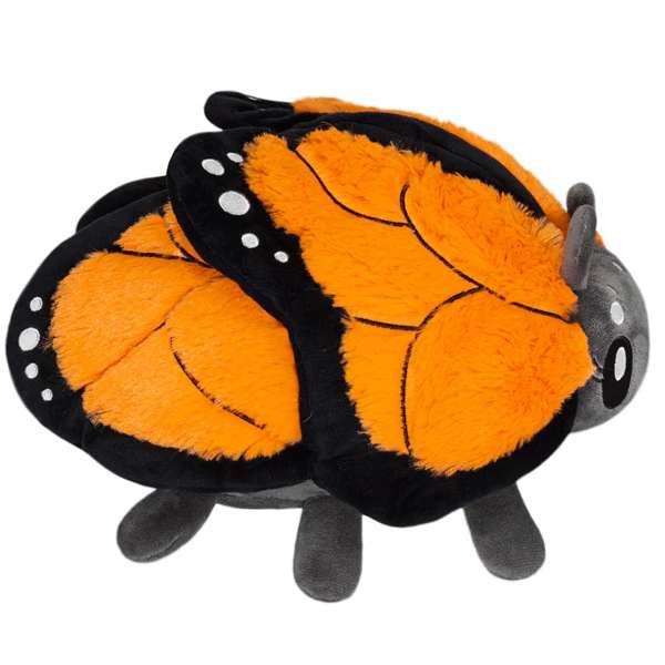 Monark sommerfugl bamse set fra siden – fluffy plush figur med orange vinger og sorte detaljer

