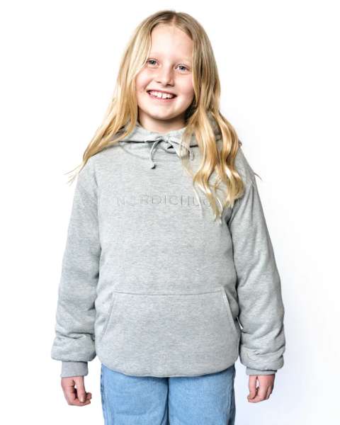 Pige i grå tyngdehoodie med løs pasform, beroligende hoodie til børn til hverdag og afslapning

