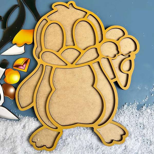 Pingvin puslespil i træ – børnepuslespil med 4 brikker vist i ramme.