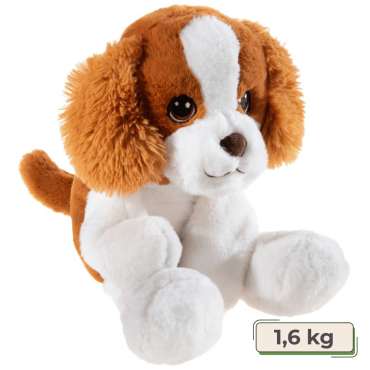  Hunden Odie Chillaxpal liggende i afslappet position med blød plys og roligt udtryk.