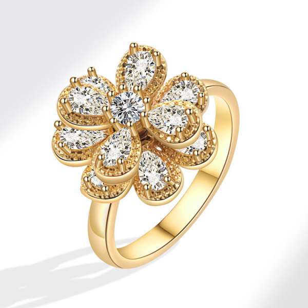 Camellia fidgetring med guldfarvet blomst og bevægeligt design – stilfuld anxiety ring til afslapning, fokus og diskret fidgeting.