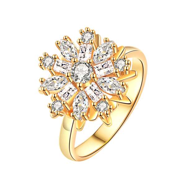 Gazania fidgetring med guldfarvet blomsterdesign og funklende sten – justerbar fidgetring til diskret fidgeting, koncentration og sensorisk stimulering.

