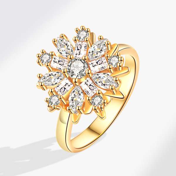 Gazania fidgetring med guldfarvet blomst og funklende sten – justerbar anxiety ring til sensorisk stimulering og afslapning.