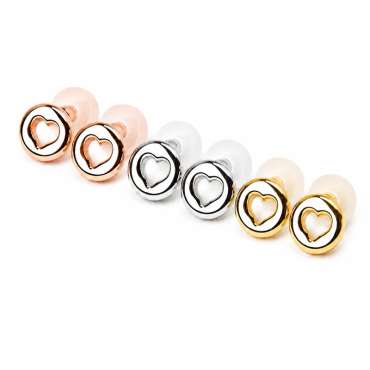Earlove Luxe ørepropper i rosaguld, sølv og guld med hjerteformet design, arrangeret parvis på række på hvid baggrund.

